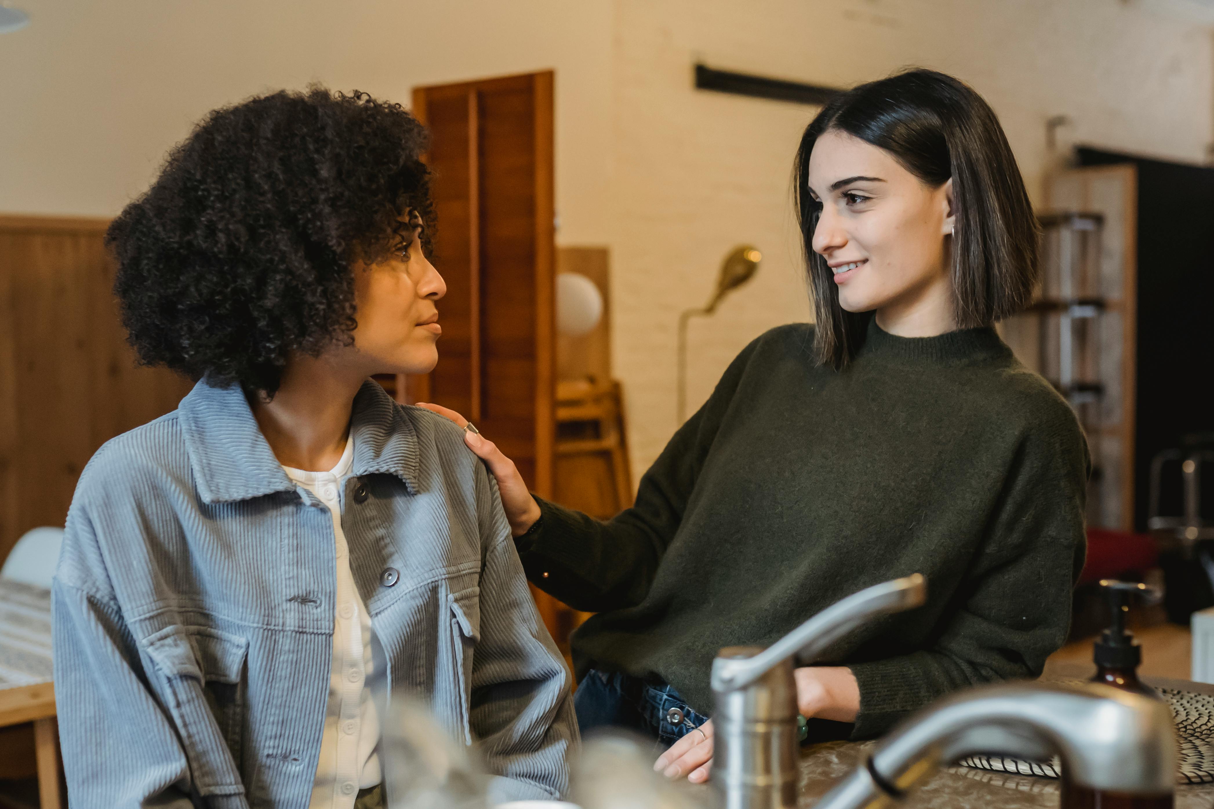two women having a supportive conversation
